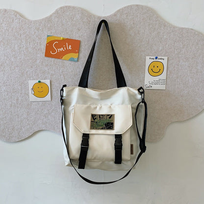 Convertible Shoulder Bag with Adjustable Strap and Multiple Compartments